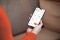 The image shows a hand with a smartphone and the ViCare app open to show Vitoair CT control via app